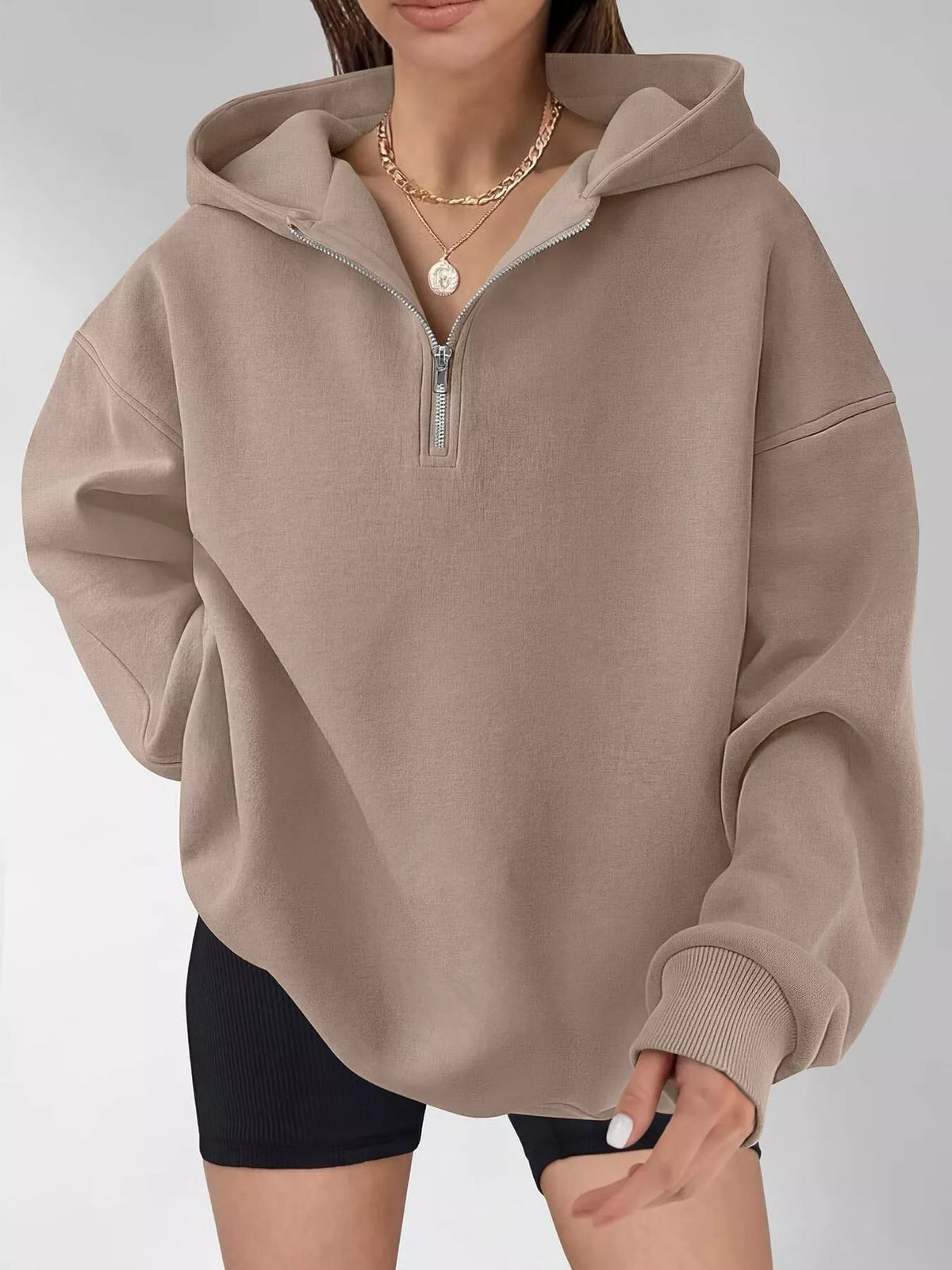 Oversized Trendsi quarter-zip hoodie in soft fabric, featuring a relaxed fit and high collar, perfect for casual wear.