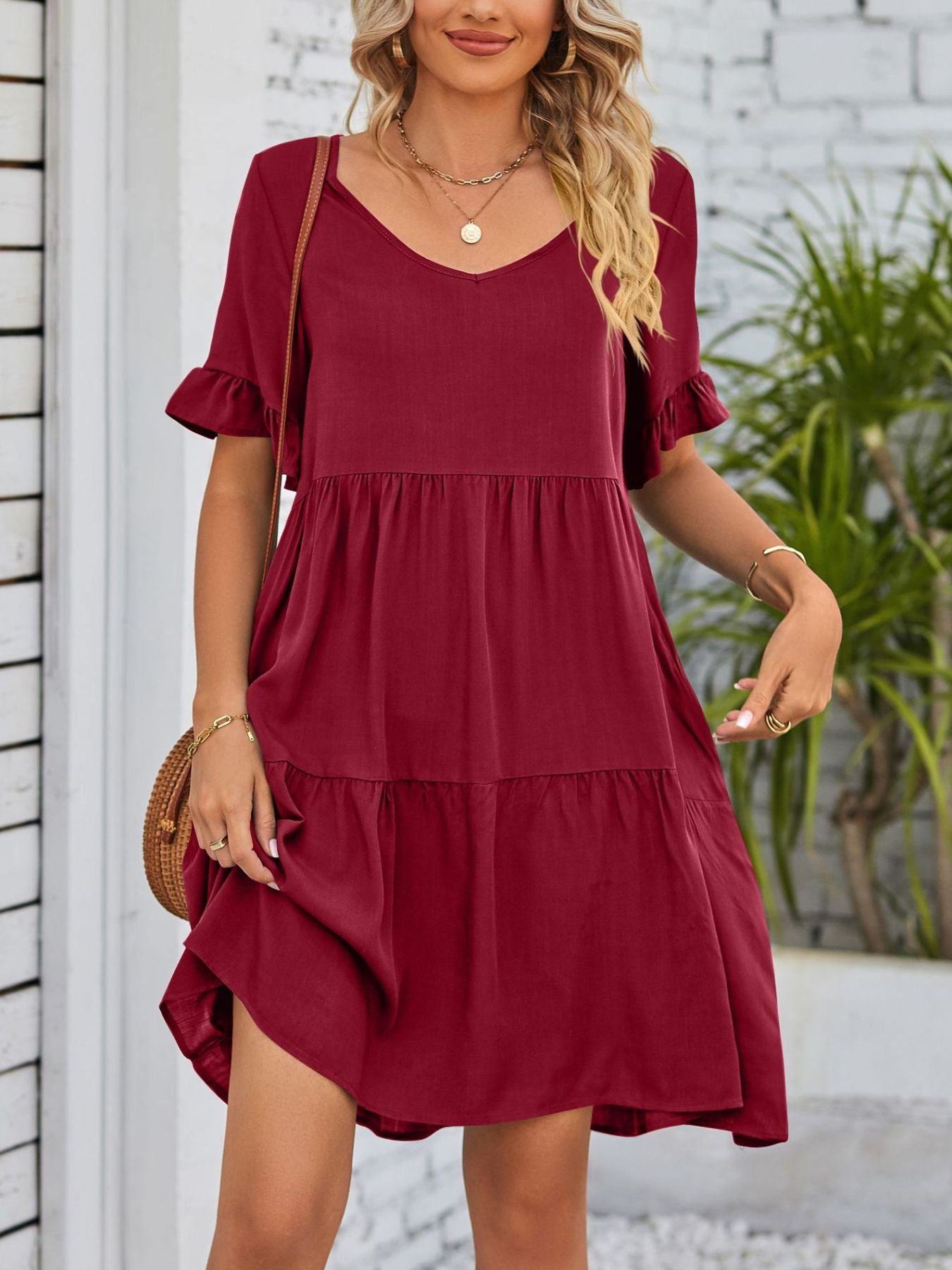 Lightweight rayon ruffled sleeve tiered mini dress with pockets, stylish and flowy, perfect for casual or summer wear.