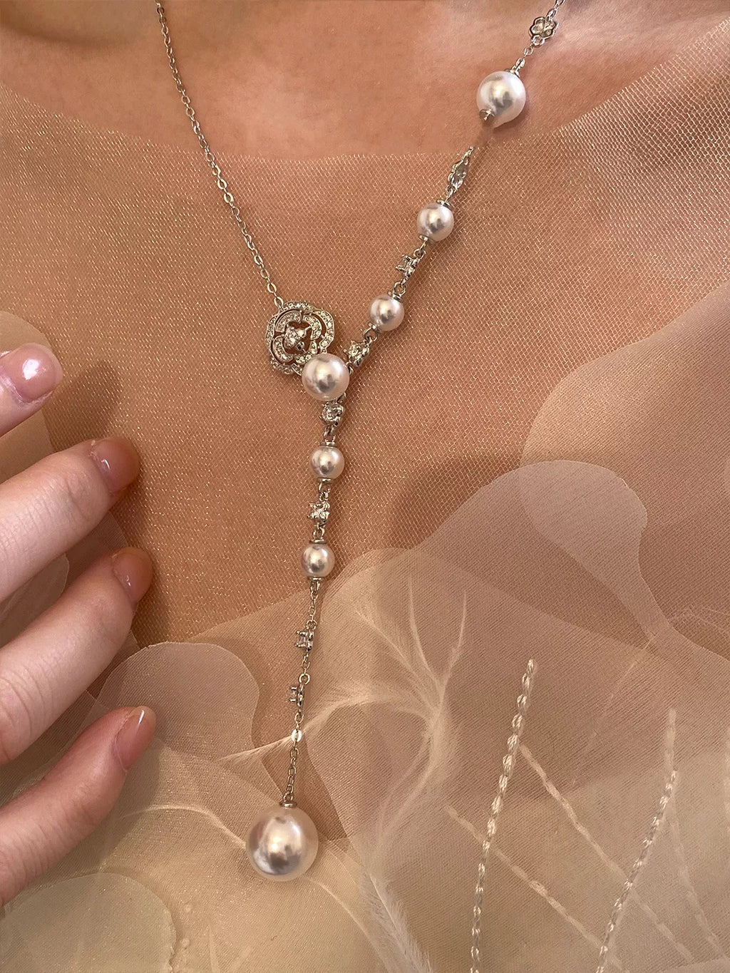 Pearl flower Y-necklace from Shopimist featuring delicate white pearls and floral design, elegant jewelry for special occasions.