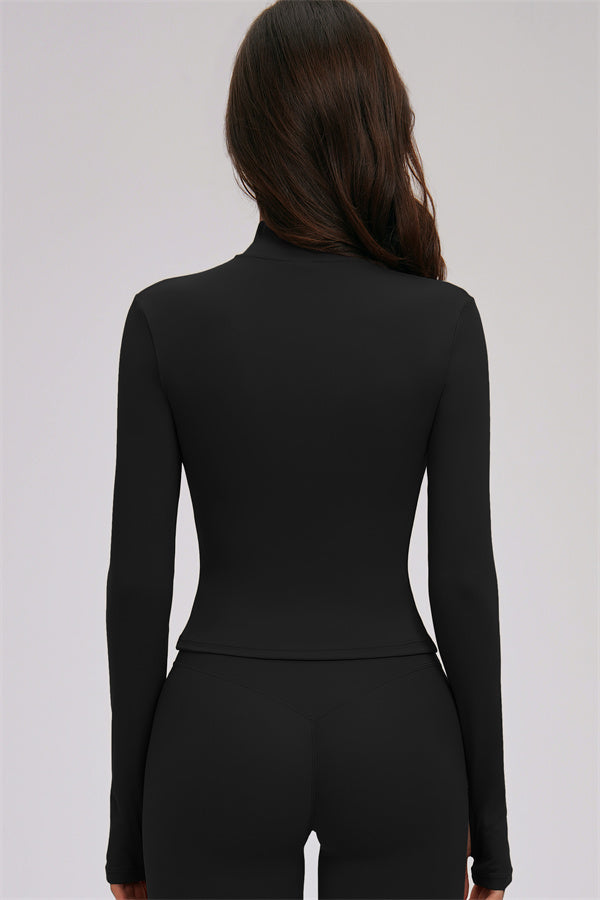 Fitglutes activewear set including a kinetic zip jacket, cross-back sports bra, and matching leggings for workouts.