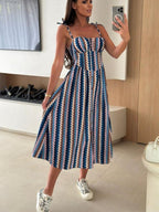 Women's striped tie-shoulder midi dress by Trendsi, casual summer dress with a relaxed fit, perfect for brunch or warm-weather outings.