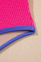 Threaded Pear Rory patchwork one-piece swimsuit with colorful fabric panels, featuring adjustable straps and a sleek fit.