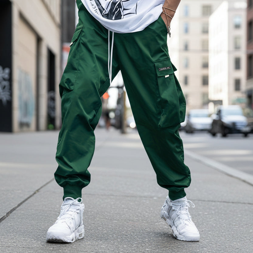 Men’s multi-pocket cargo pants from Plush Fashion Hub featuring a streetwear style with drawstring waist and multiple functional pockets.