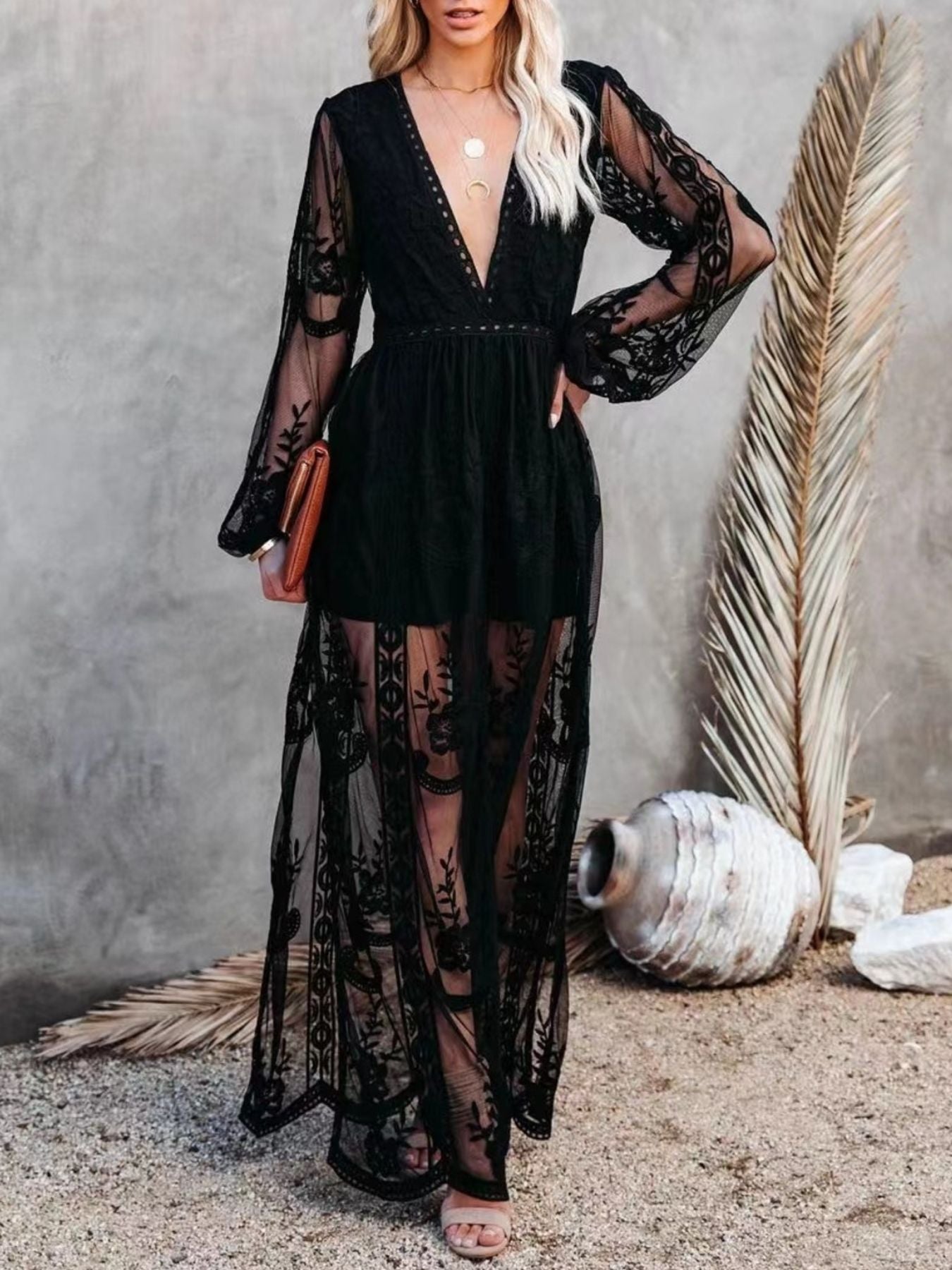 Floral lace high-slit maxi dress by Trendsi featuring an elegant evening gown design with detailed lace and flowing fabric.