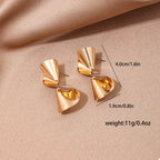 18K gold-plated twist earrings with sleek, modern design, featuring a shiny finish and elegant spiral shape.