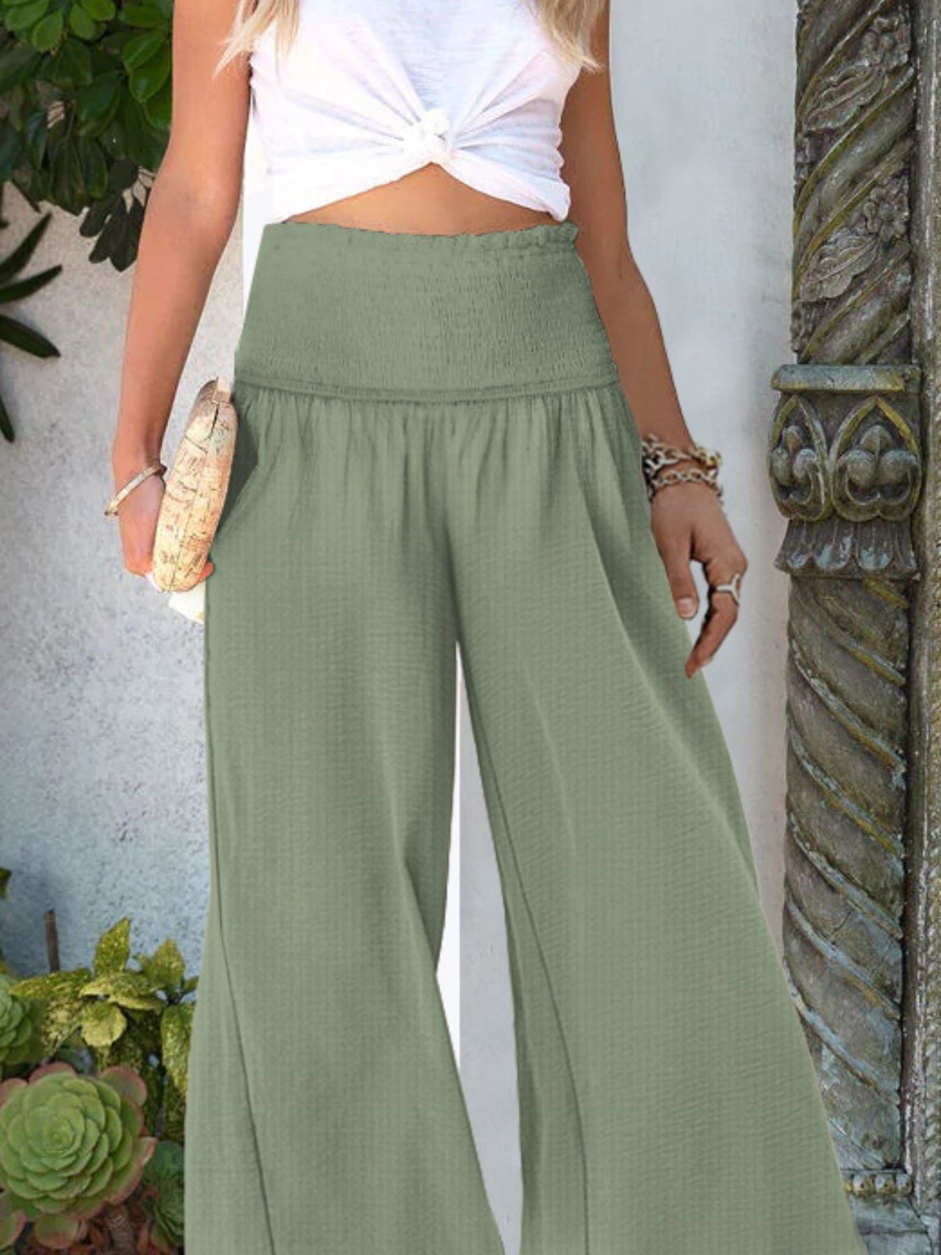 Women's wide-leg casual trousers with smocked waist, lightweight and comfortable, styled for a relaxed look.