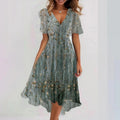 Floral print FitiqueFit A-line V-neck short sleeve midi dress displayed on a hanger, showcasing its vibrant pattern and flowing silhouette.