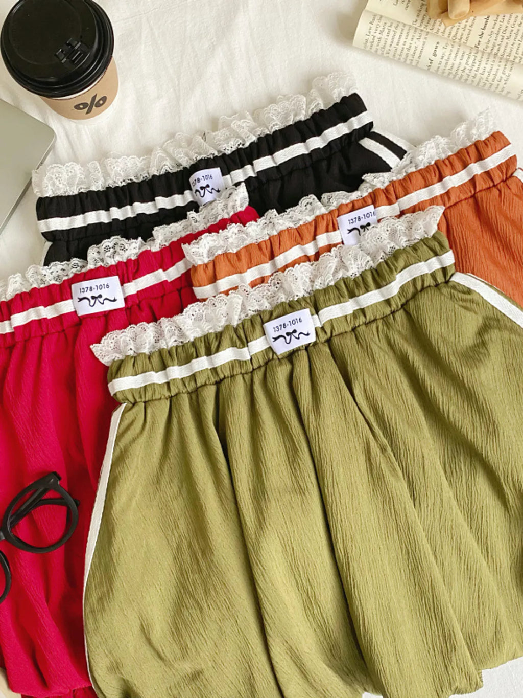 Lace trim elastic waist mini skirt in soft fabric, featuring a stylish fit and trendy design, perfect for casual or dressy outfits.