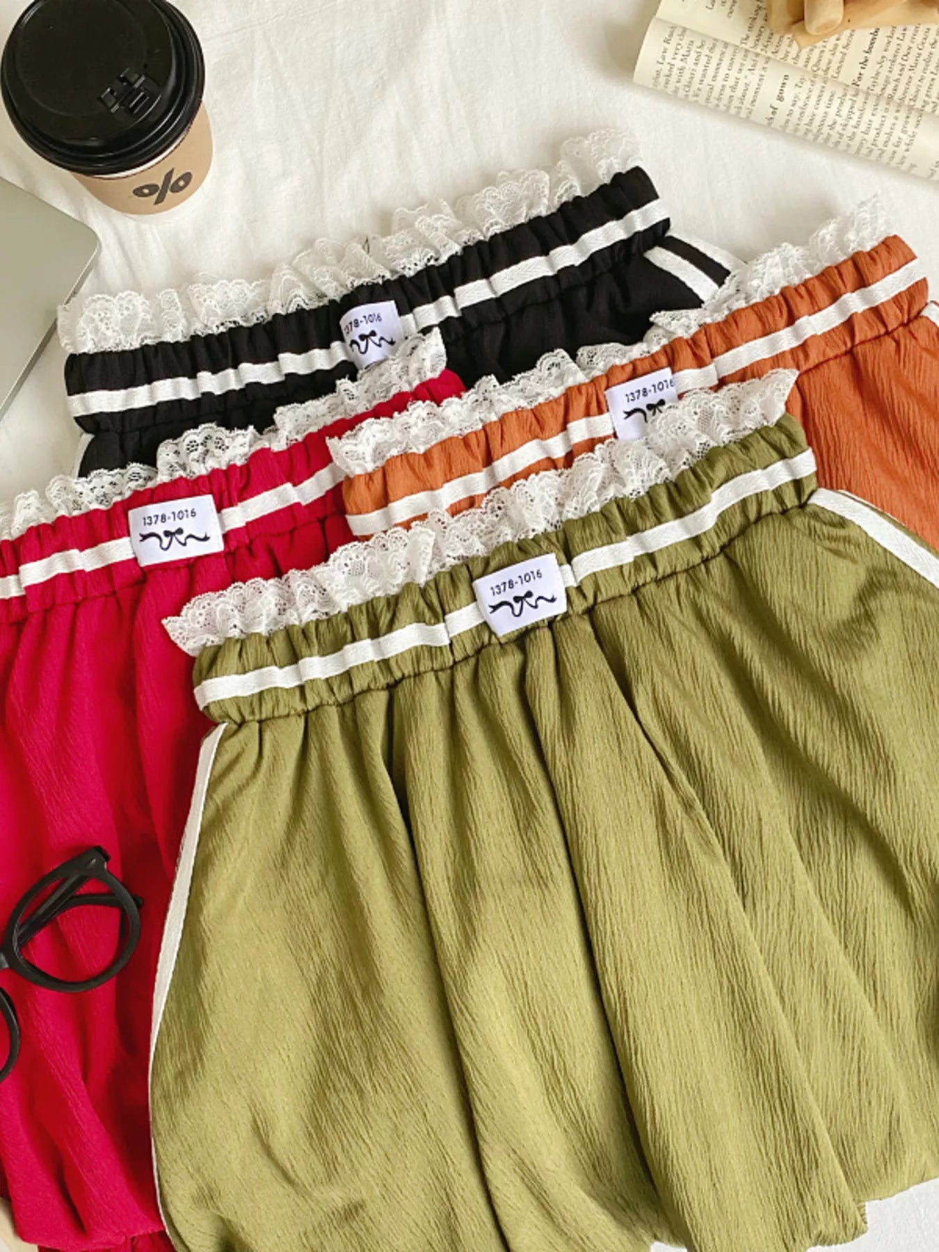 Lace trim elastic waist mini skirt in soft fabric, featuring a stylish fit and trendy design, perfect for casual or dressy outfits.