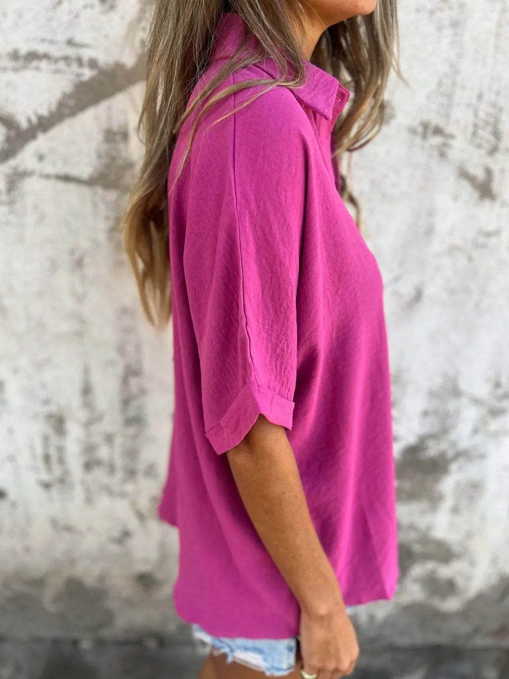 Women's collared half sleeve button-down blouse by Trendsi, tailored office top featuring a sophisticated design and classic style.