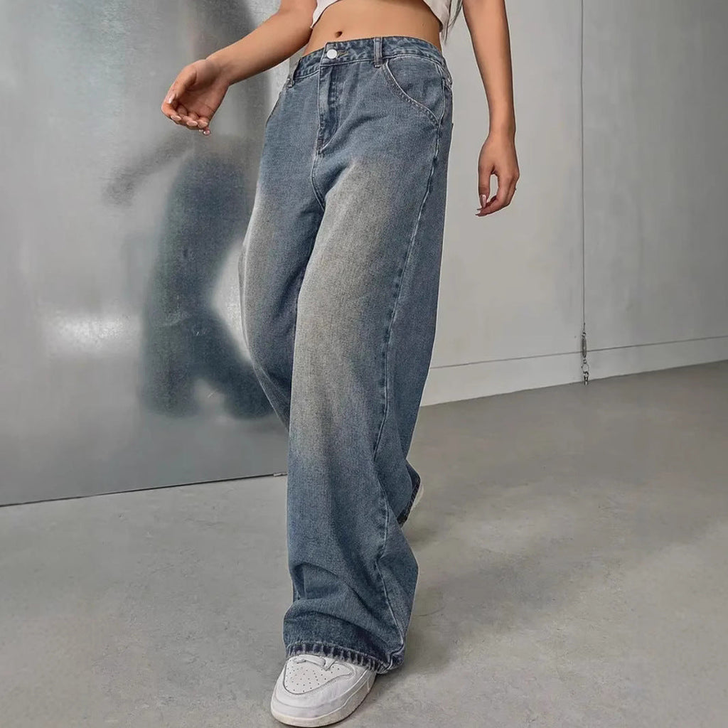 European and American women's washed vintage denim pants by LadyShow.Store, showing the relaxed fit and distressed details.