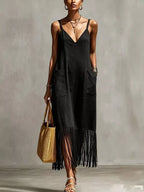 Plus size fringe V-neck spaghetti strap dress by Shopimist, showing a full-length black dress with fringed hem and V-neck design.