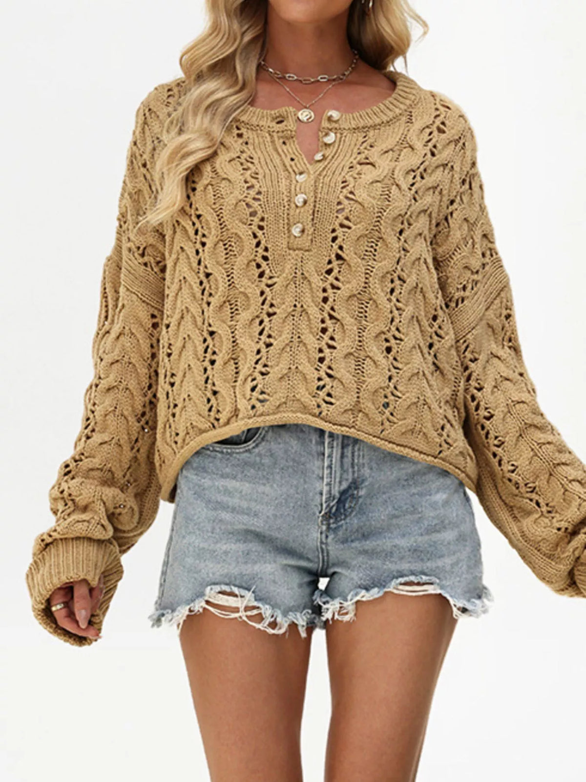 Chic cable knit half-button openwork sweater by Trendsi, featuring a cozy textured design and stylish openwork details.
