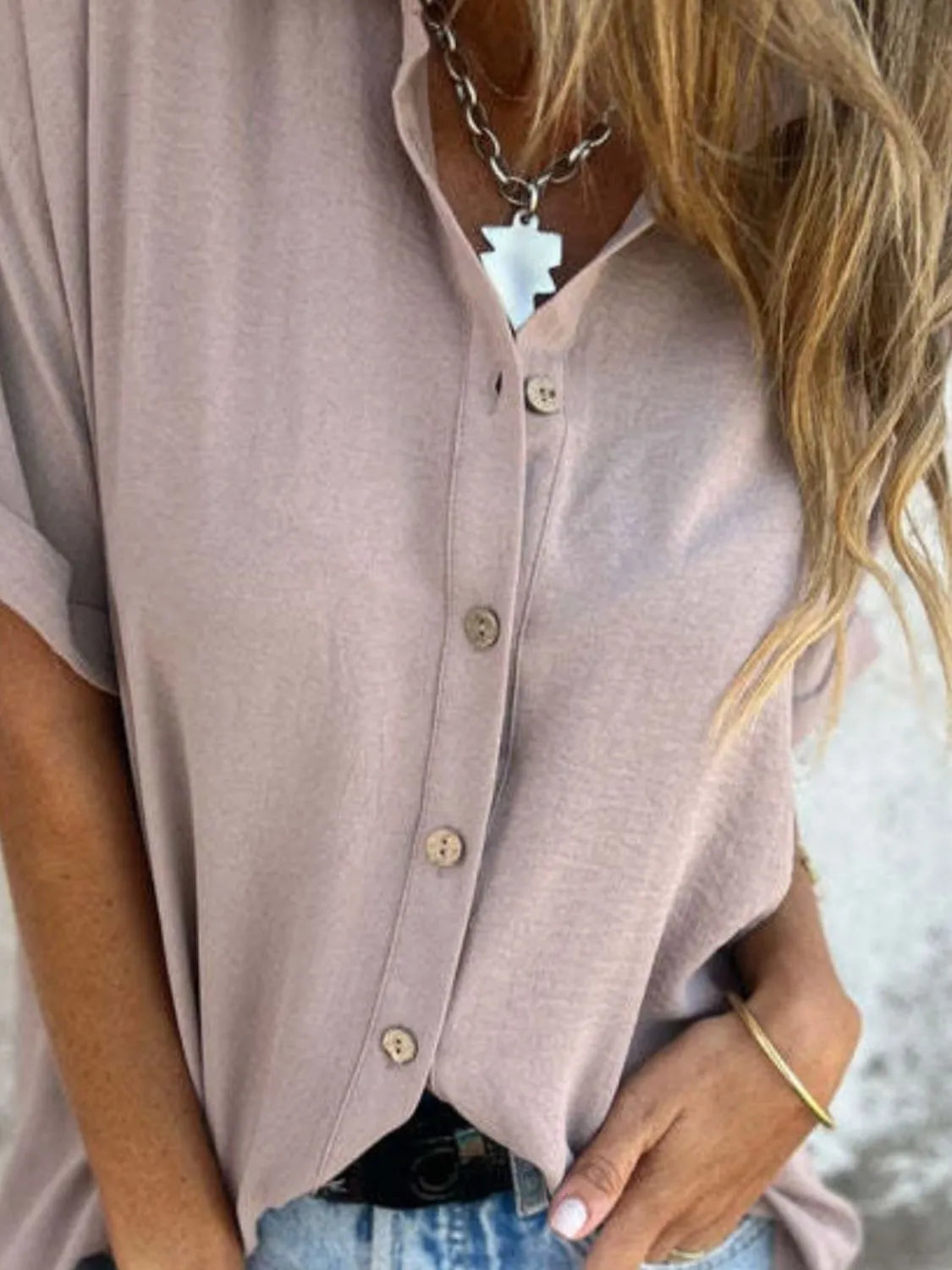 Women's collared half sleeve button-down blouse by Trendsi, featuring a sophisticated office shirt with a classic collar and tailored fit.