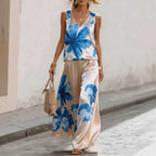 Women's floral printed sleeveless vest and pants two-piece set by FitiqueFit, featuring a stylish sleeveless top and matching pants.