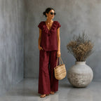 Plush Fashion Hub women's casual two-piece set with V-neck ruffled hem top and wide-leg pants, perfect for relaxed style.