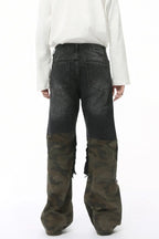 Distressed camouflage patchwork jeans by Trendsi featuring ripped details and a rugged, stylish camo design.