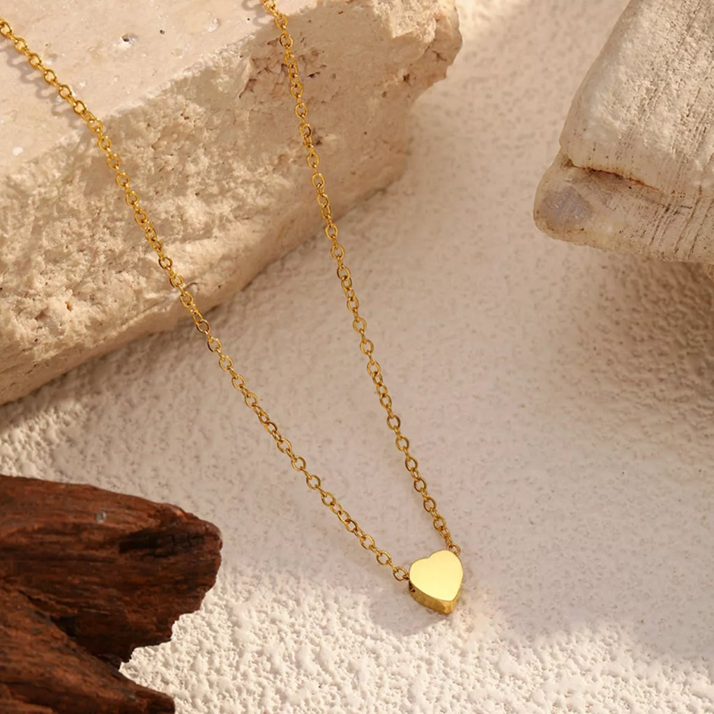 18K gold-plated heart pendant necklace with a delicate chain, showcasing the elegant design and shiny finish.