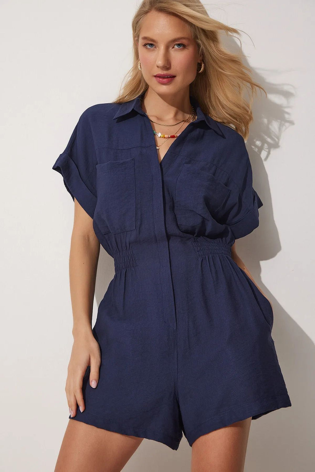 Women's cotton linen loose-fit workwear jumpsuit with pockets, stylish and comfortable for casual or workwear, by Plush Fashion Hub.