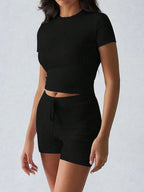 Trendsi active wear set featuring a round neck short sleeve top and matching shorts, perfect for casual and workout wear.