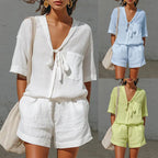 Women's lace-up short-sleeve shirt and loose shorts set from Plush Fashion Hub, casual summer co-ord outfit, shown laid flat.