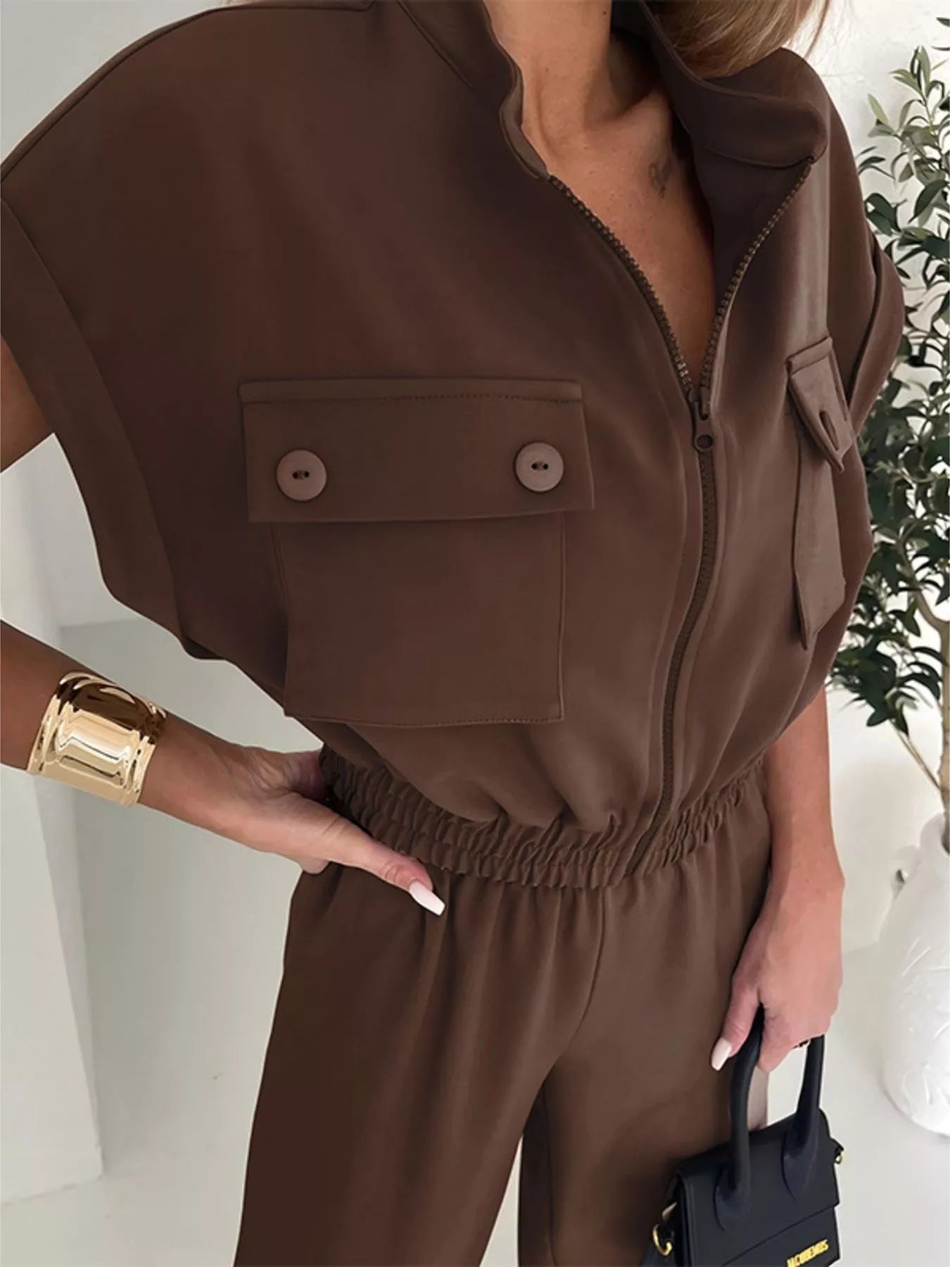 Black cargo pocket zipper front jumpsuit by Shopimist, featuring functional pockets and a front zipper closure.
