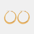 18K gold-plated hoop earrings with a sleek, polished finish, showcasing classic round design and smooth edges.