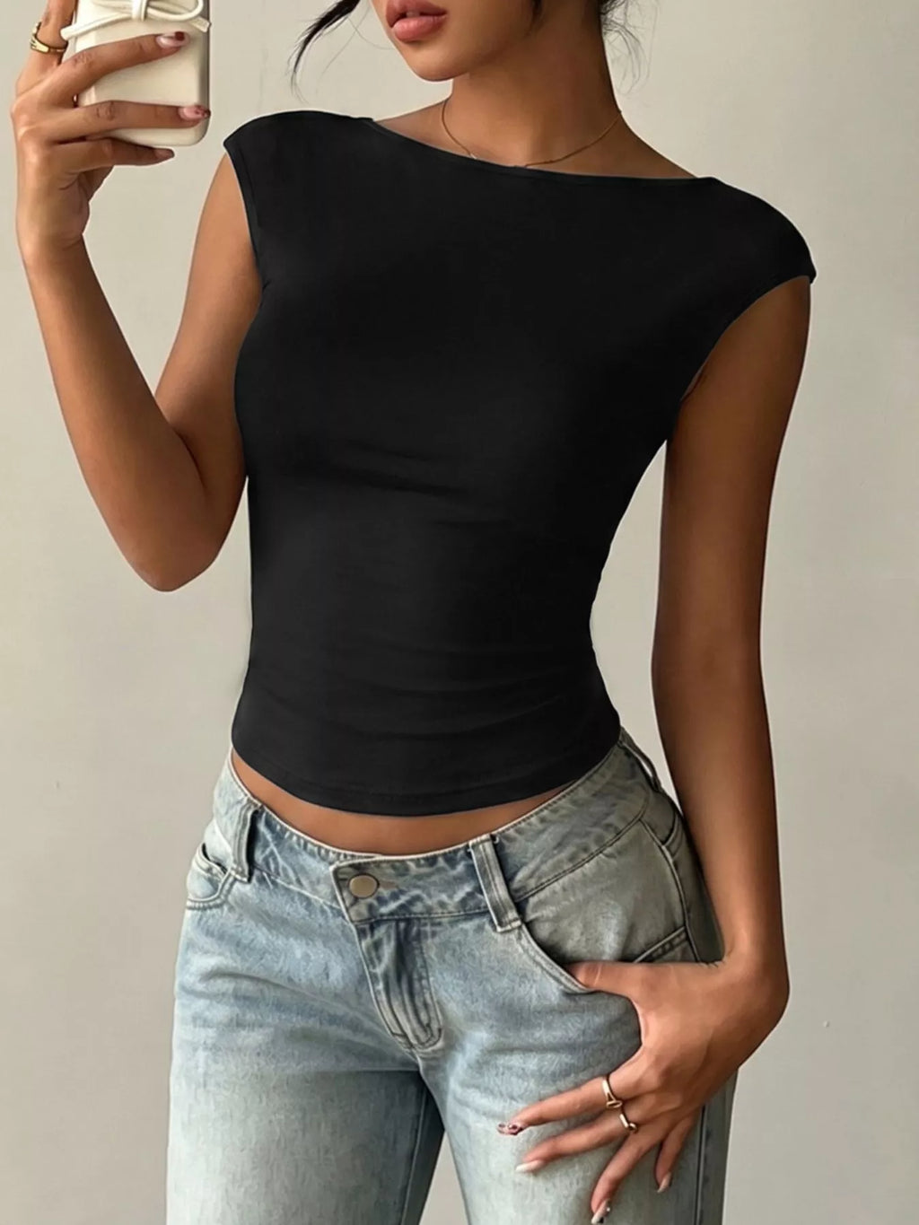 Lace detail cap-sleeve T-shirt from Trendsi, featuring a fitted top with delicate lace accents and a versatile design.