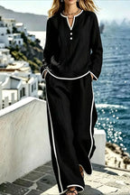 Contrast trim lounge set with long sleeve top and pants by Trendsi, featuring a comfortable, stylish design for casual wear.