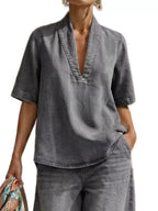 Plus size women's dress set with half sleeve top and wide-leg pants by Trendsi, featuring a comfortable, stylish fit.