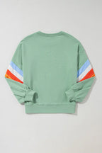 Contrast round neck long sleeve sweatshirt from Trendsi, featuring a casual fit and stylish design in a close-up view.