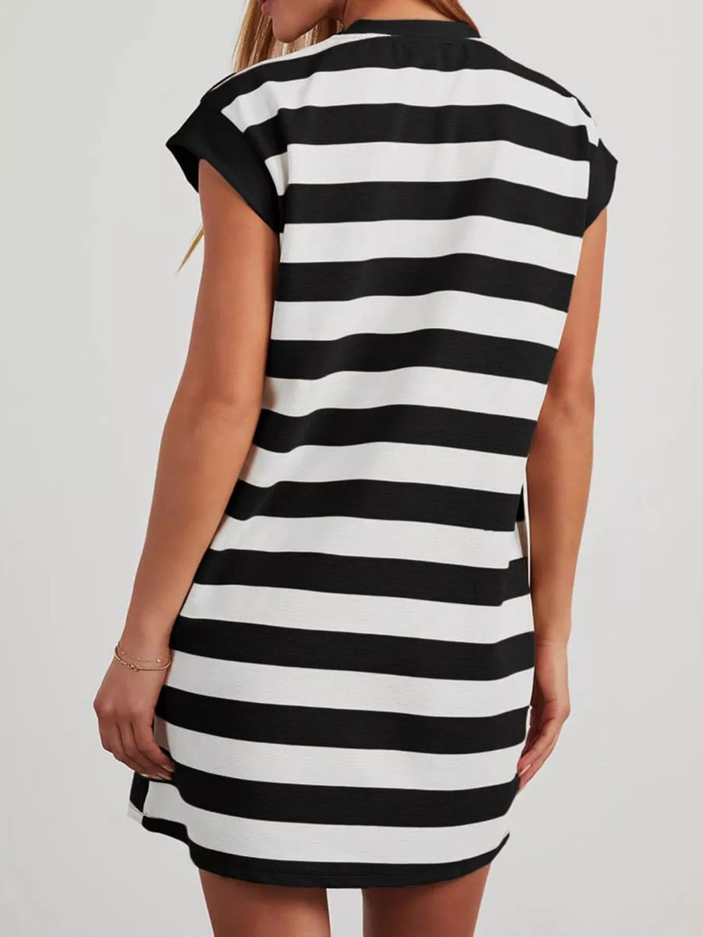 Plus size casual striped short sleeve mini dress from Trendsi, featuring a relaxed fit and stylish design.