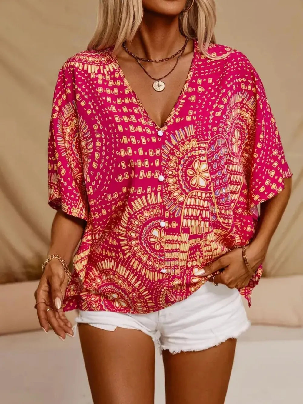 Women's printed V-neck half sleeve casual top by Plush Fashion Hub, soft stretch office blouse with colorful floral pattern.