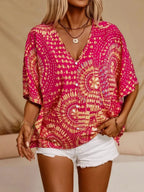 Women's printed V-neck half sleeve casual top by Plush Fashion Hub, soft stretch office blouse with colorful floral pattern.