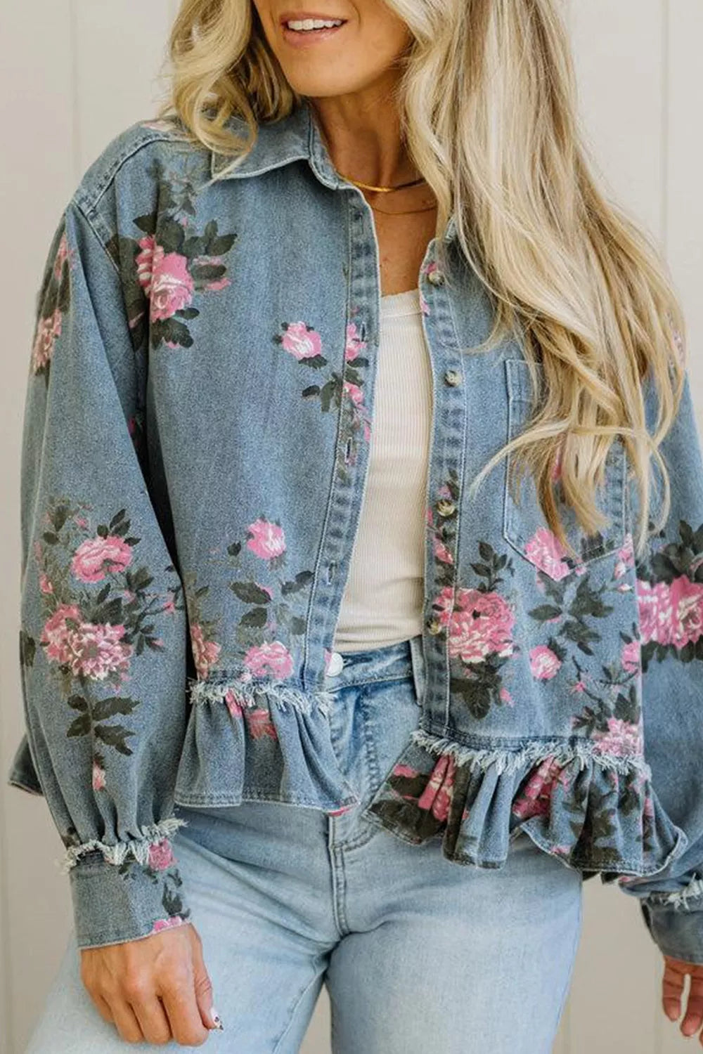 Floral print denim jacket with ruffled hem by Plush Fashion Hub, featuring colorful floral patterns and a stylish casual design.