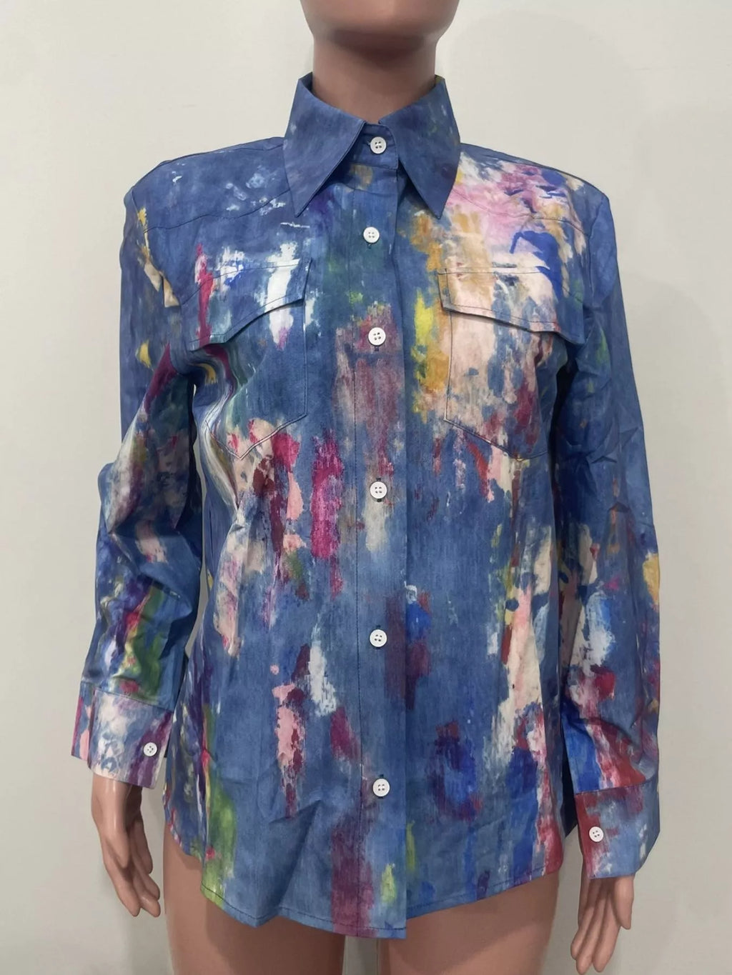 Artistic painted long sleeve denim shirt by Plush Fashion Hub featuring colorful, creative designs on a classic blue denim fabric.