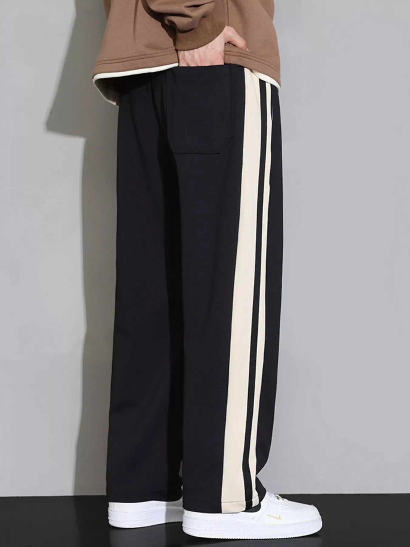 Men's plus size casual loose pants with side stripes, stylish and comfortable, from Shopimist, displayed with a relaxed fit.