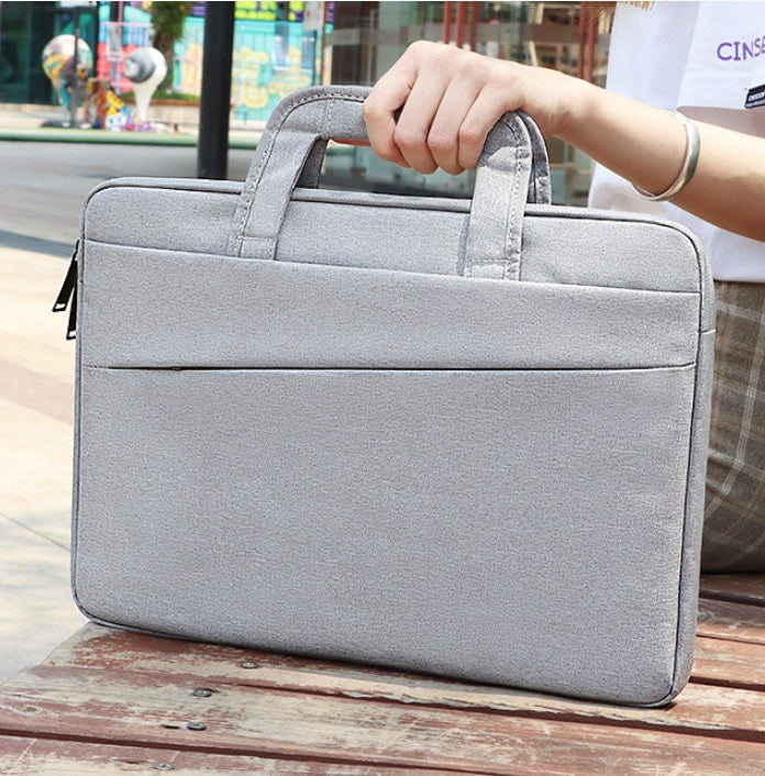Black Plush Fashion Hub laptop bag with padded compartments and sleek handles, designed for business and professional use.
