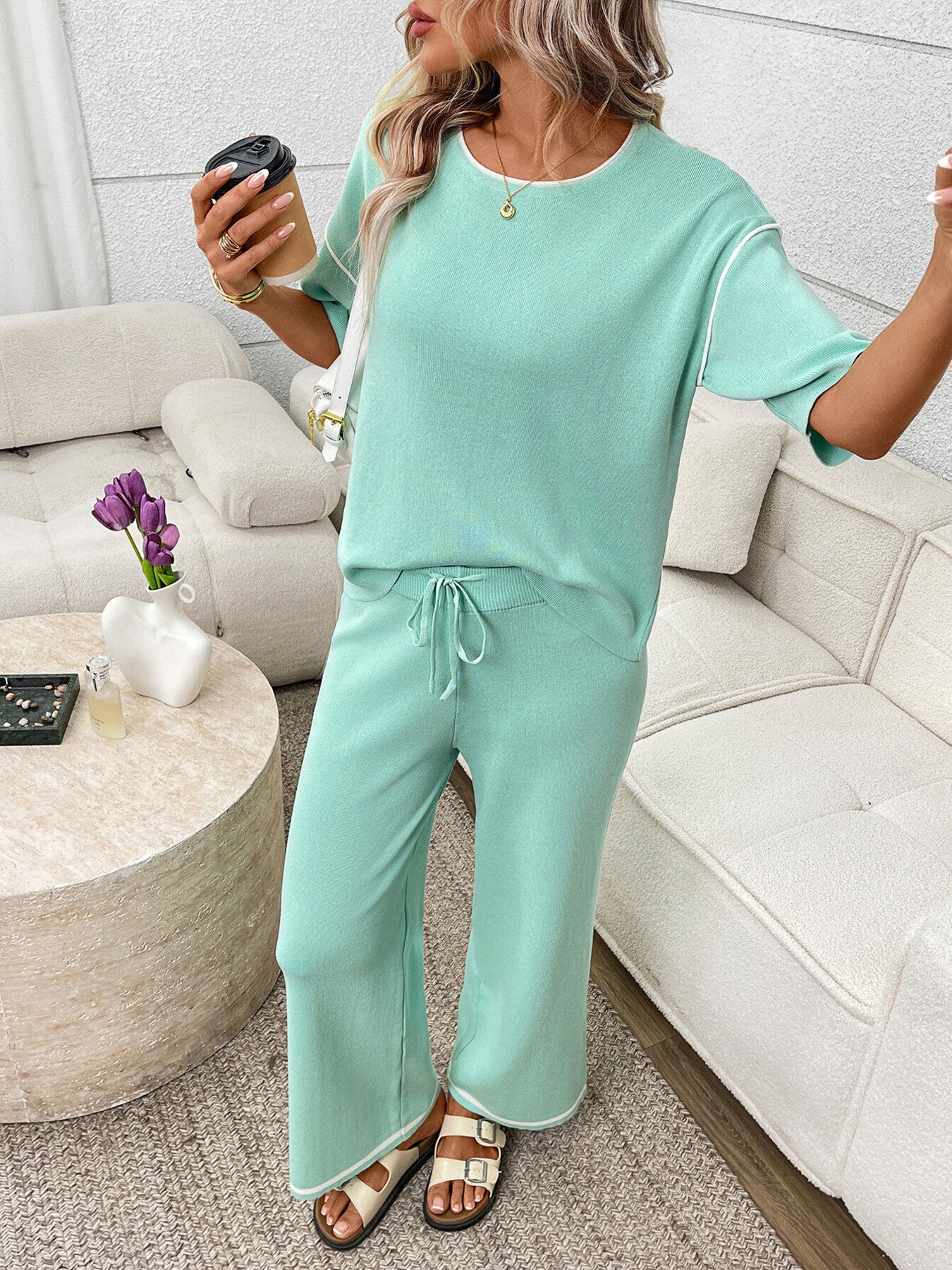 Women's casual two-piece lounge set with round neck top and drawstring pants, comfortable and stylish from Trendsi.