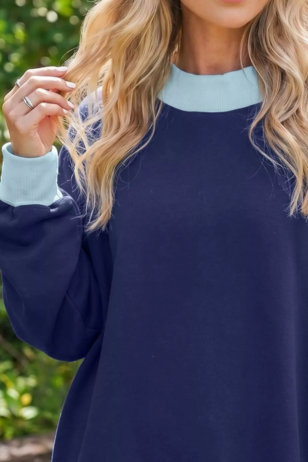 Colorblock trim crewneck long sleeve sweater by Trendsi featuring a casual pullover design with contrasting color accents.