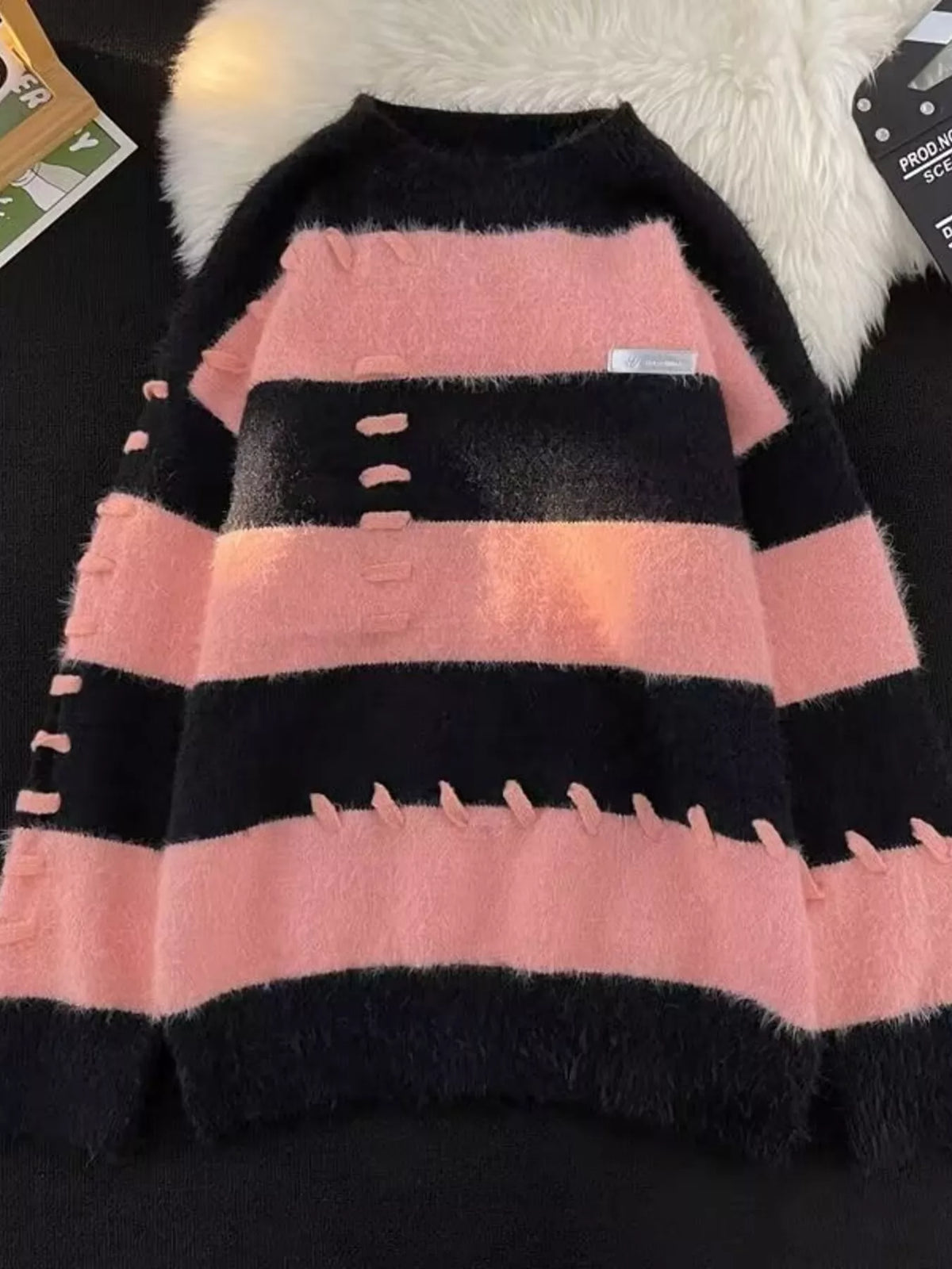Men's striped knit round neck sweater from Trendsi, featuring a cozy fit and stylish pattern, perfect for casual wear.