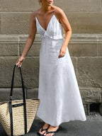 Women's ruffled V-neck cotton maxi dress by Trendsi, featuring a flowy boho design and summer-ready style.