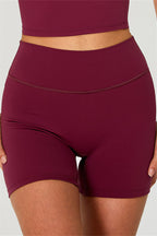 Fitglutes activewear: One-shoulder crop top and matching shorts 2-piece gym set, stylish sportswear for workout and active lifestyle.
