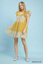 Umgee mix patchwork flutter sleeve tiered dress with colorful fabric and flowing design, perfect for casual or bohemian style.