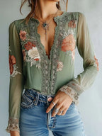Women’s floral print V-neck blouse by Plush Fashion Hub, casualwear with a feminine V-neck and colorful floral pattern.