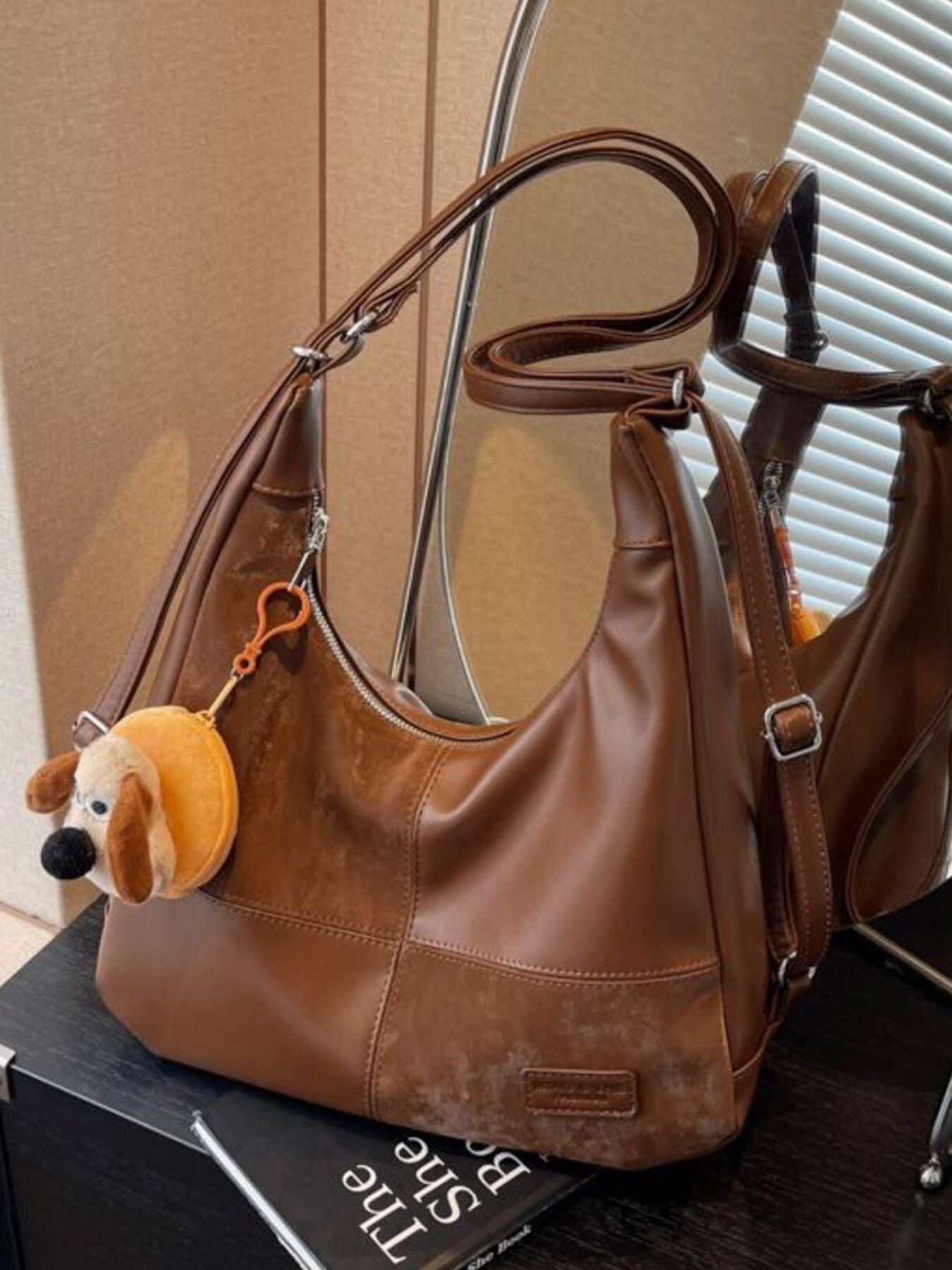 Vintage-inspired Trendsi PU leather slouchy hobo shoulder bag with adjustable strap and spacious interior, displayed against a neutral background.