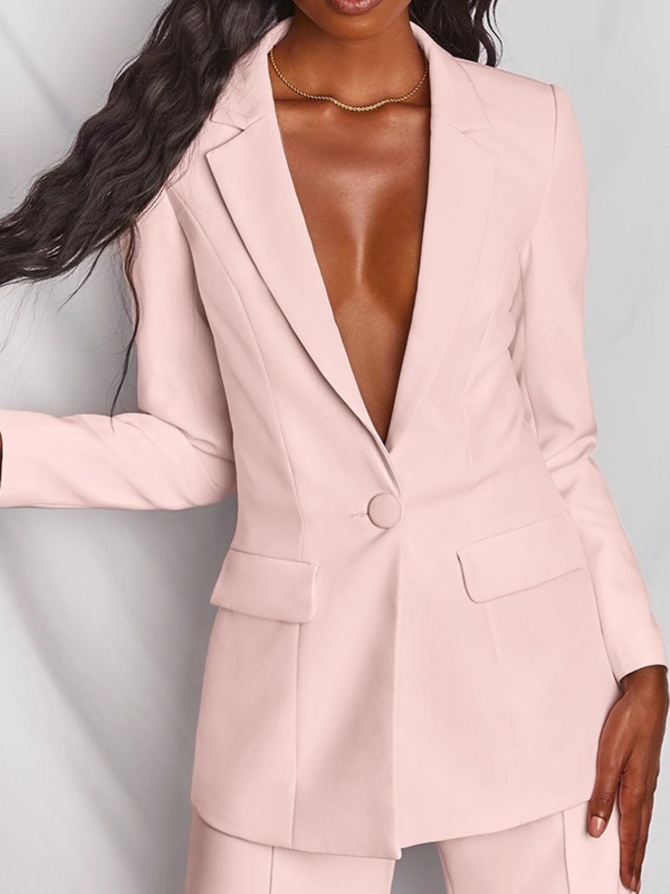 Plus size Trendsi blazer and wide-leg pants set, featuring a one-button blazer and flowy pant style, shown in the image.