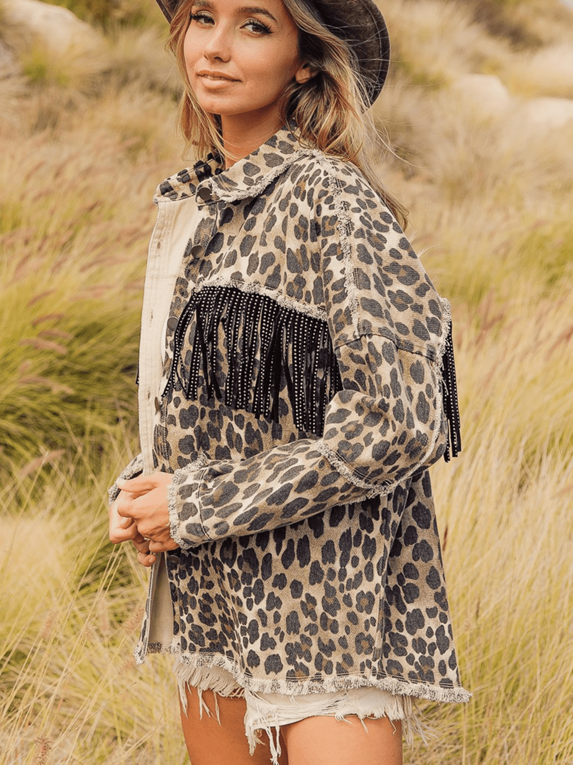 VYSN leopard fringe detail collared denim jacket showing leopard print fringe accents and classic blue denim fabric.