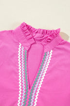 Cotton ruffled notched cap sleeve mini dress by Trendsi, featuring a stylish design with ruffles and a notched neckline.