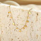 18K gold-plated charm bracelet with delicate links and small decorative charms, stylish jewelry by Shopimist.